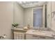 Modern bathroom with a marble vanity and updated fixtures at 535 Sanctuary Dr # A202, Longboat Key, FL 34228