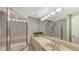 Clean bathroom with shower and tub at 535 Sanctuary Dr # A202, Longboat Key, FL 34228