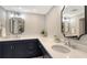 Modern bathroom with double vanity and corner sink at 535 Sanctuary Dr # A202, Longboat Key, FL 34228