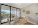 Light and airy dining area with access to balcony at 535 Sanctuary Dr # A202, Longboat Key, FL 34228