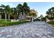 Community entrance with gate and landscaping at 535 Sanctuary Dr # A202, Longboat Key, FL 34228