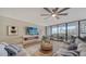 Living room with fireplace and sliding doors to balcony at 535 Sanctuary Dr # A202, Longboat Key, FL 34228