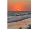 Serene ocean view at sunset with waves gently lapping the shore at 535 Sanctuary Dr # A202, Longboat Key, FL 34228