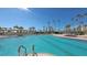 Inviting swimming pool with ample space for lounging at 535 Sanctuary Dr # A202, Longboat Key, FL 34228