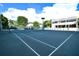 Well-maintained tennis court with surrounding greenery at 535 Sanctuary Dr # A202, Longboat Key, FL 34228