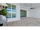 Outdoor kitchen with pool and lake view at 8332 Sea Glass Ct, Sarasota, FL 34240