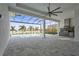 Outdoor kitchen with pool and lake view at 8332 Sea Glass Ct, Sarasota, FL 34240