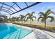 Enclosed pool and spa with lake view at 8332 Sea Glass Ct, Sarasota, FL 34240