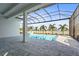 Enclosed pool and spa with lake view at 8332 Sea Glass Ct, Sarasota, FL 34240