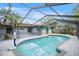 A screened-in swimming pool features custom design and ample deck space for lounging at 2204 51St E Blvd, Bradenton, FL 34208