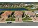 Three homes with attached garages and terracotta roofs at 4734 Tortona Ct, Bradenton, FL 34211