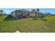Spacious backyard with screened patio and lush lawn at 4734 Tortona Ct, Bradenton, FL 34211