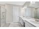 Double vanity bathroom with large mirror at 4734 Tortona Ct, Bradenton, FL 34211