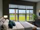 Main bedroom with water views; virtually staged at 4734 Tortona Ct, Bradenton, FL 34211