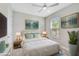 Bright bedroom with a queen bed, neutral decor, and natural light at 4734 Tortona Ct, Bradenton, FL 34211