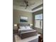 Spacious bedroom with ceiling fan; virtually staged at 4734 Tortona Ct, Bradenton, FL 34211