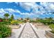 Community garden with raised garden beds and a walkway at 4734 Tortona Ct, Bradenton, FL 34211