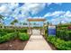 Entrance to community garden with pergola and signage at 4734 Tortona Ct, Bradenton, FL 34211