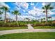 Fenced dog park with palm trees and grassy area at 4734 Tortona Ct, Bradenton, FL 34211