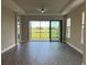 Bright living room with sliding glass doors at 4734 Tortona Ct, Bradenton, FL 34211