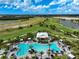 Aerial view of resort-style pool with surrounding lounge chairs at 4734 Tortona Ct, Bradenton, FL 34211