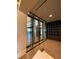 Modern glass-enclosed wine room with numerous wine bottles at 4734 Tortona Ct, Bradenton, FL 34211