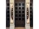 Modern wine storage with individual lockers and wall mounted wine racks at 4734 Tortona Ct, Bradenton, FL 34211