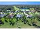 Bird's-eye view of a house in a golf course community at 7917 Broadmoor Pines Blvd, Sarasota, FL 34243