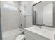 Clean bathroom with single vanity, bathtub, and shower at 2400 Ezzell Ct, Sarasota, FL 34237