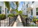 Townhouse community walkway with lush landscaping at 2400 Ezzell Ct, Sarasota, FL 34237