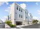 Townhouses with attached garages and a street view at 2400 Ezzell Ct, Sarasota, FL 34237