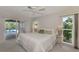 Main bedroom with sliding glass doors leading to a private pool area at 444 Bellini Cir, Nokomis, FL 34275