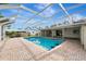 Inviting pool area with a screened enclosure at 444 Bellini Cir, Nokomis, FL 34275