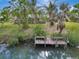 Private dock with serene canal views at 444 Bellini Cir, Nokomis, FL 34275