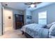 Bedroom with a ceiling fan and an armoire at 4747 Motta Ct, Bradenton, FL 34211