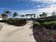 Entrance to the community with pergola and landscaping at 4747 Motta Ct, Bradenton, FL 34211