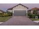 Two-car garage and manicured lawn at 4747 Motta Ct, Bradenton, FL 34211