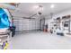 Garage with overhead storage and epoxy flooring at 4747 Motta Ct, Bradenton, FL 34211