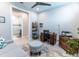 Home office with built-in shelving and adjacent bathroom at 4747 Motta Ct, Bradenton, FL 34211