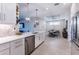 Modern white kitchen with stainless steel appliances and an island at 4747 Motta Ct, Bradenton, FL 34211