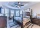 Spacious main bedroom with a king-size bed and large windows at 4747 Motta Ct, Bradenton, FL 34211