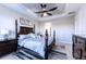 Spacious main bedroom with a king-size bed and dark wood furniture at 4747 Motta Ct, Bradenton, FL 34211