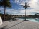 Resort pool with lounge chairs and palm trees at 4747 Motta Ct, Bradenton, FL 34211