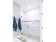 Large walk-in shower with white tile and glass enclosure at 4747 Motta Ct, Bradenton, FL 34211