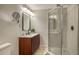 Updated bathroom with a walk-in shower, modern vanity, and stylish fixtures at 5610 Avenida Del Mare, Sarasota, FL 34242