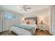 Spacious bedroom with a king-size bed and a ceiling fan at 5610 Avenida Del Mare, Sarasota, FL 34242