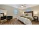 Well-lit bedroom with a queen bed and wood floors at 5610 Avenida Del Mare, Sarasota, FL 34242