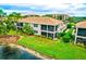 Aerial view showcasing a condo with water access at 7914 Grand Estuary Trl # 102, Bradenton, FL 34212