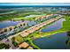 Aerial view of community, highlighting location and surrounding golf course at 7914 Grand Estuary Trl # 102, Bradenton, FL 34212