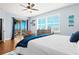 Spacious bedroom with water view, hardwood floors, and walkout balcony at 7914 Grand Estuary Trl # 102, Bradenton, FL 34212